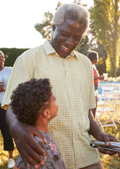 Grandfather laughing with his grandchild
