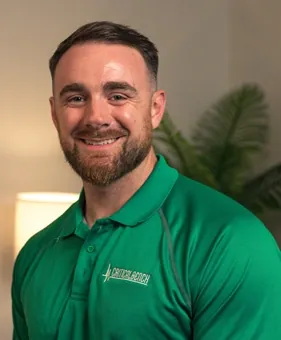 Man in a green polo shirt, the presenter of the Joint Glide sales video